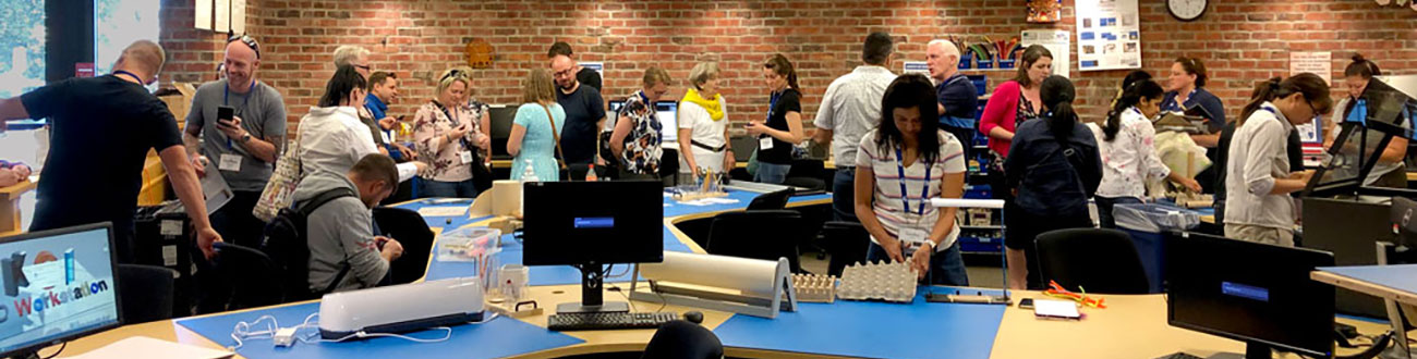 a room with people working on different machines