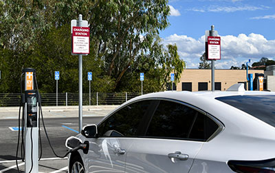 car parked with ev charging station