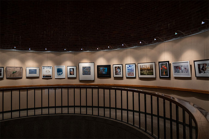 KCI gallery with photographs on circular wall