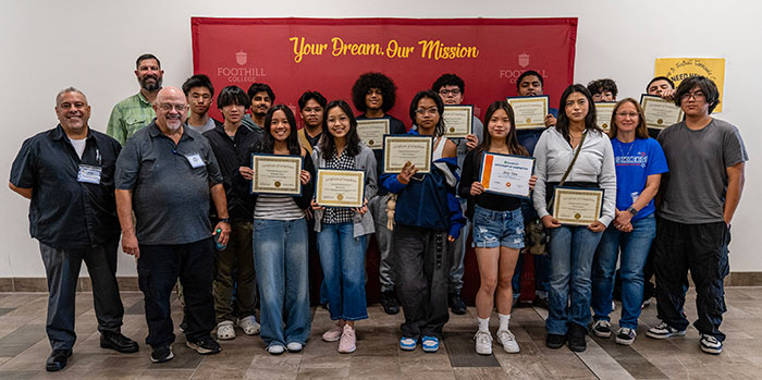 group of students holding certificates