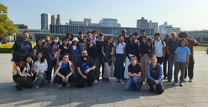 Large group of student with buildings in background