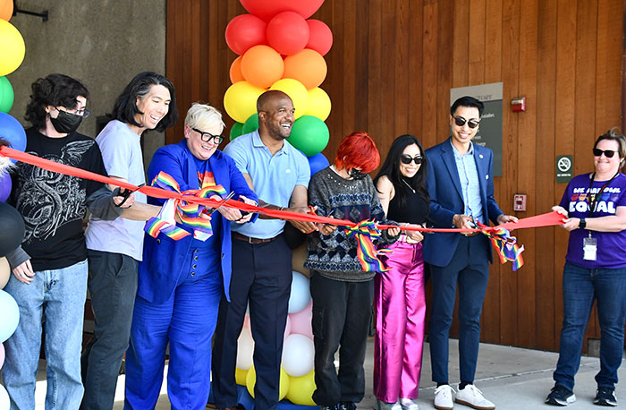 Line of people at cutting ribbon