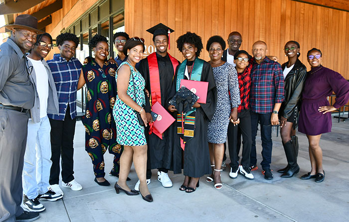 Large group of family members with two graduates